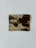 brown cowhide pouch