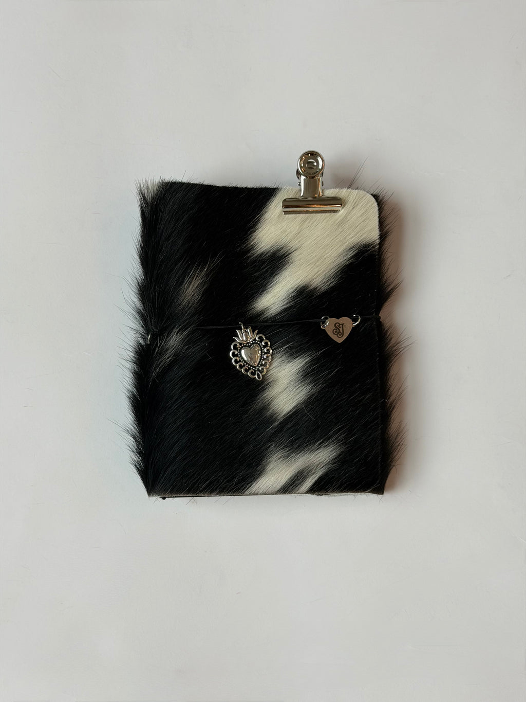 dark cowhide with surprise charm 🐮