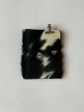 dark cowhide with surprise charm 🐮