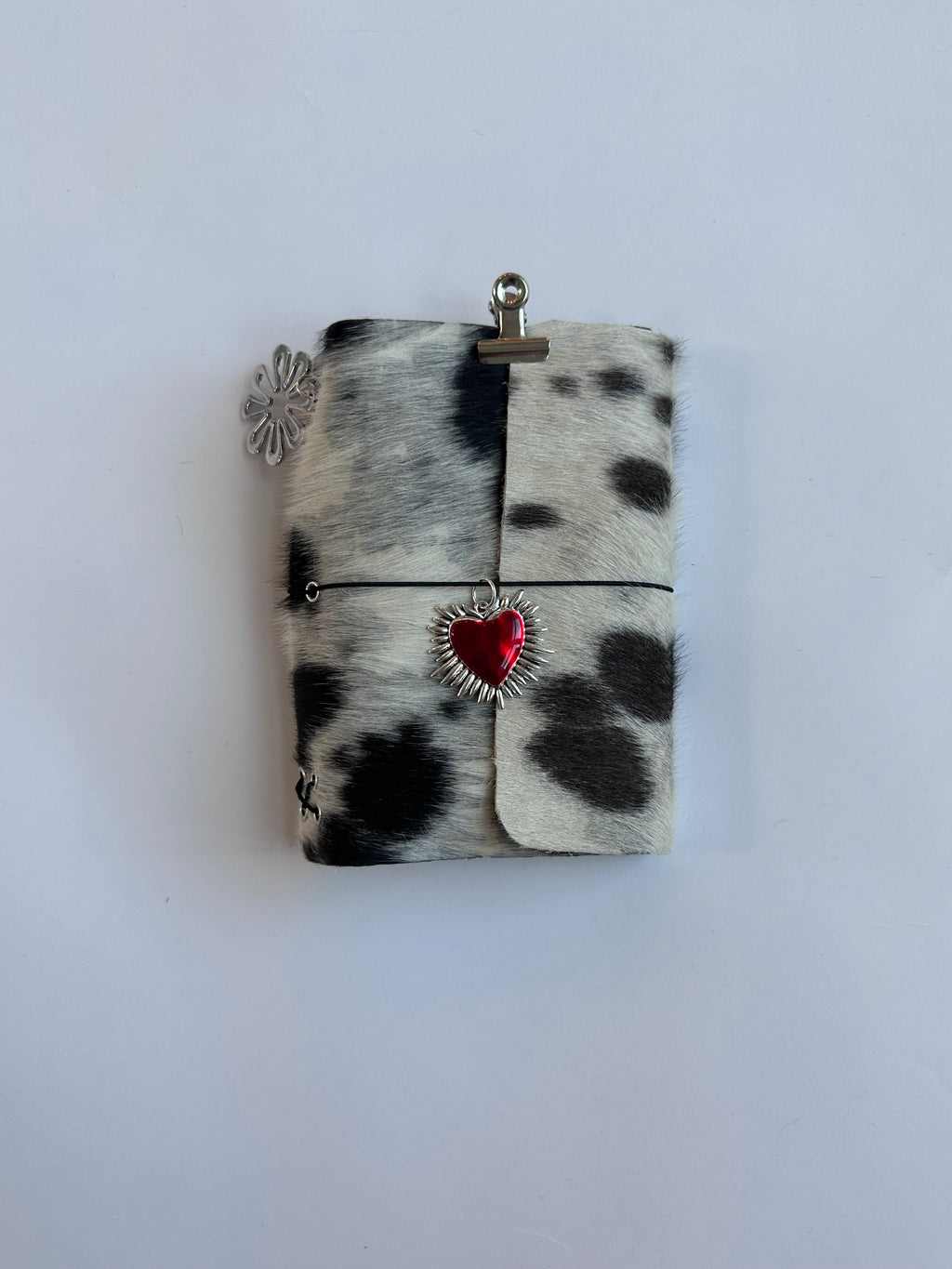 dark cowhide with surprise charm 🐮