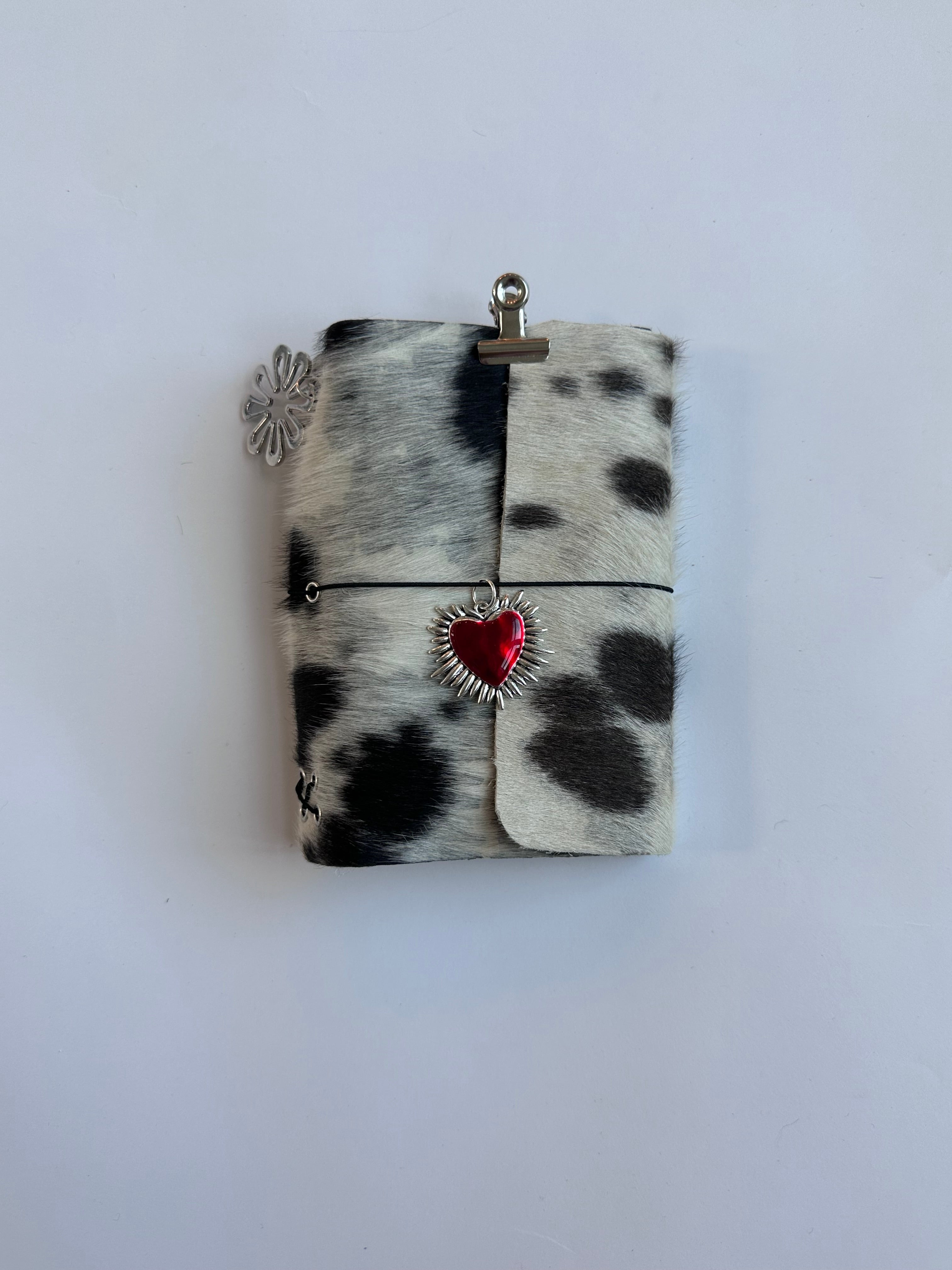 dark cowhide with surprise charm 🐮