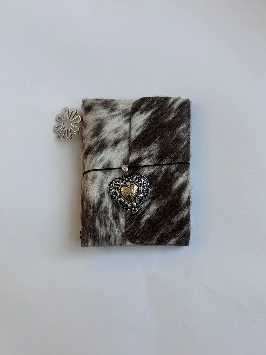 brown cowhide with surprise charm 🐮