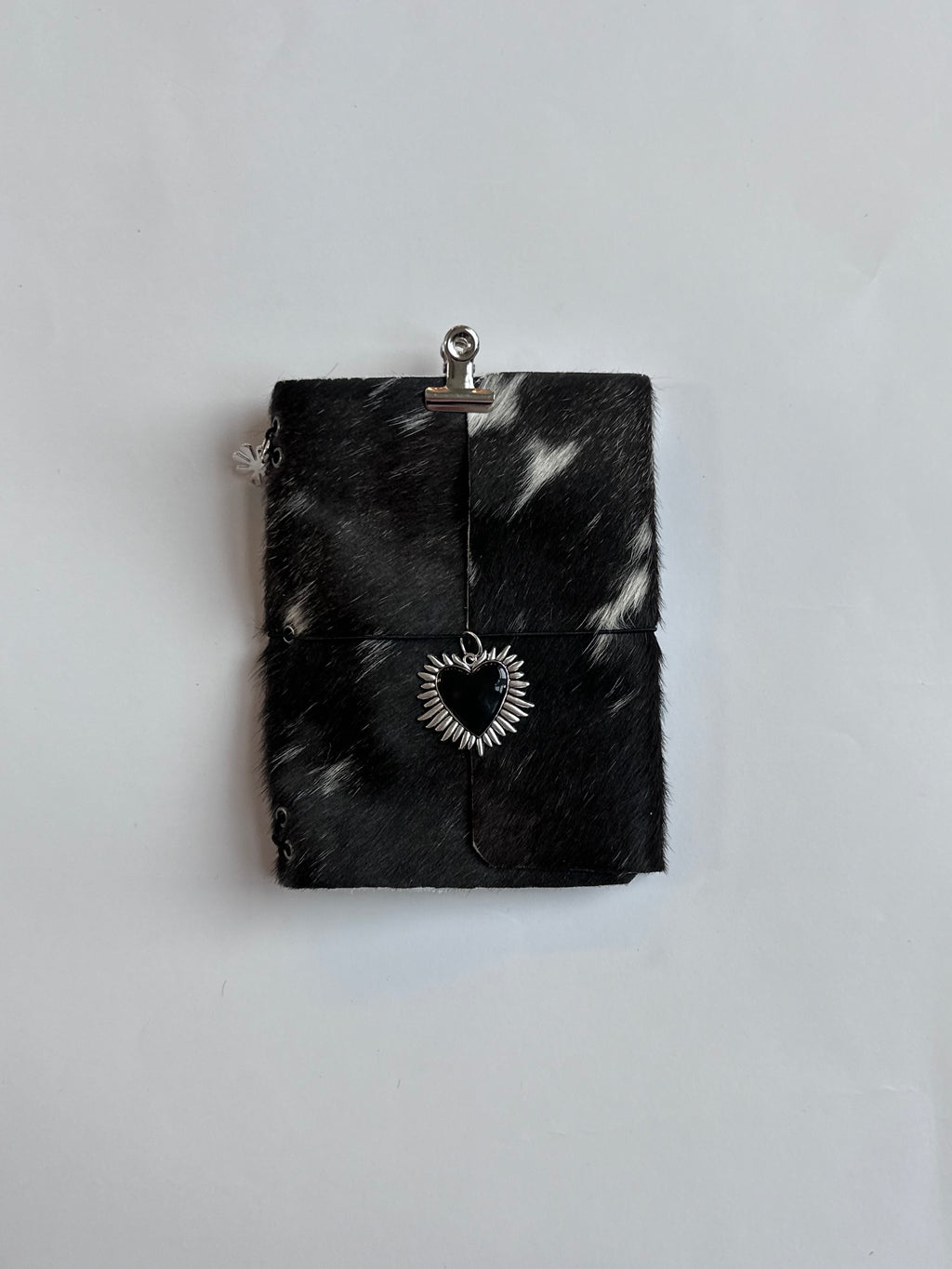 dark cowhide with surprise charm 🐮