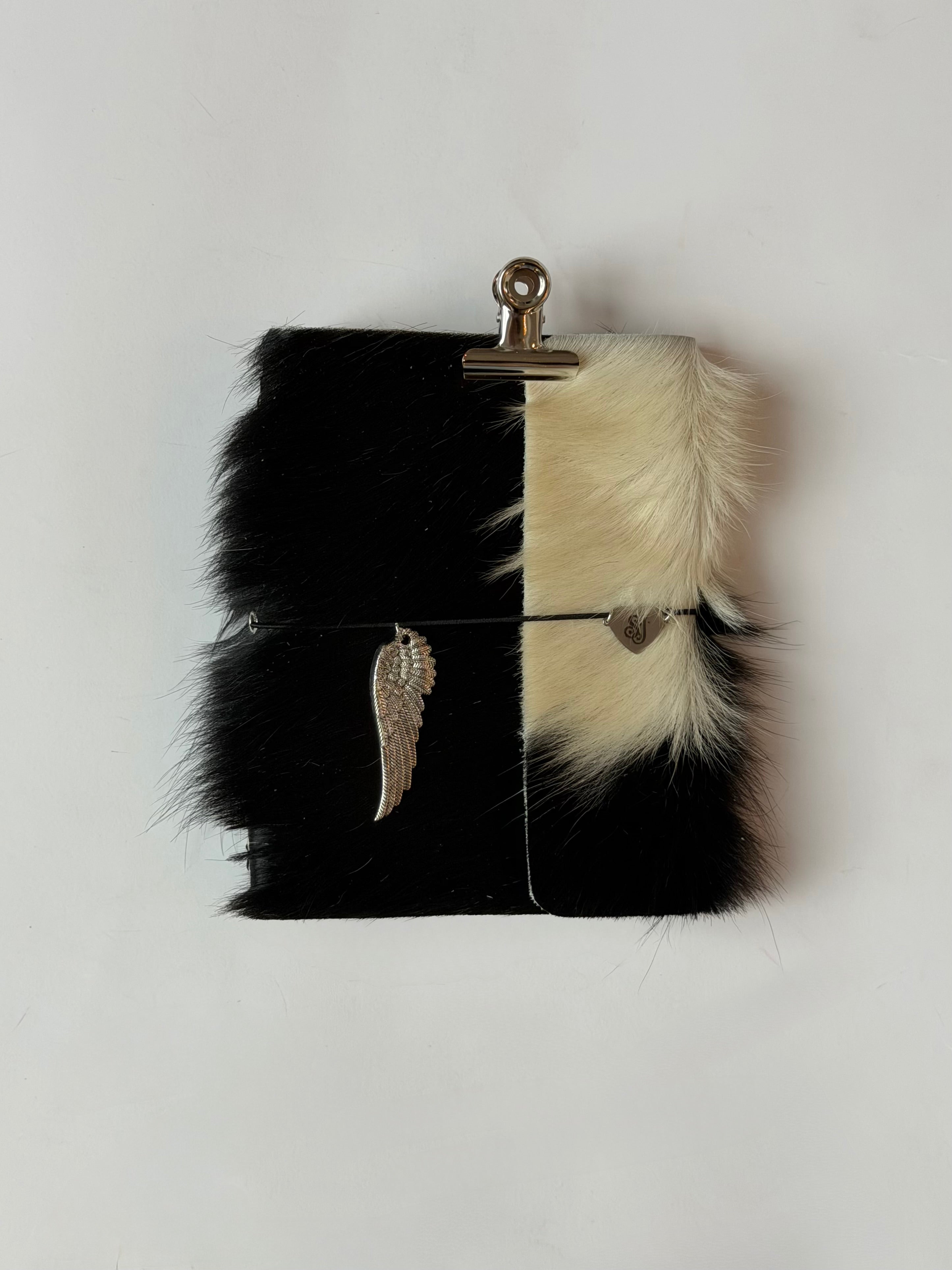 dark cowhide with surprise charm 🐮