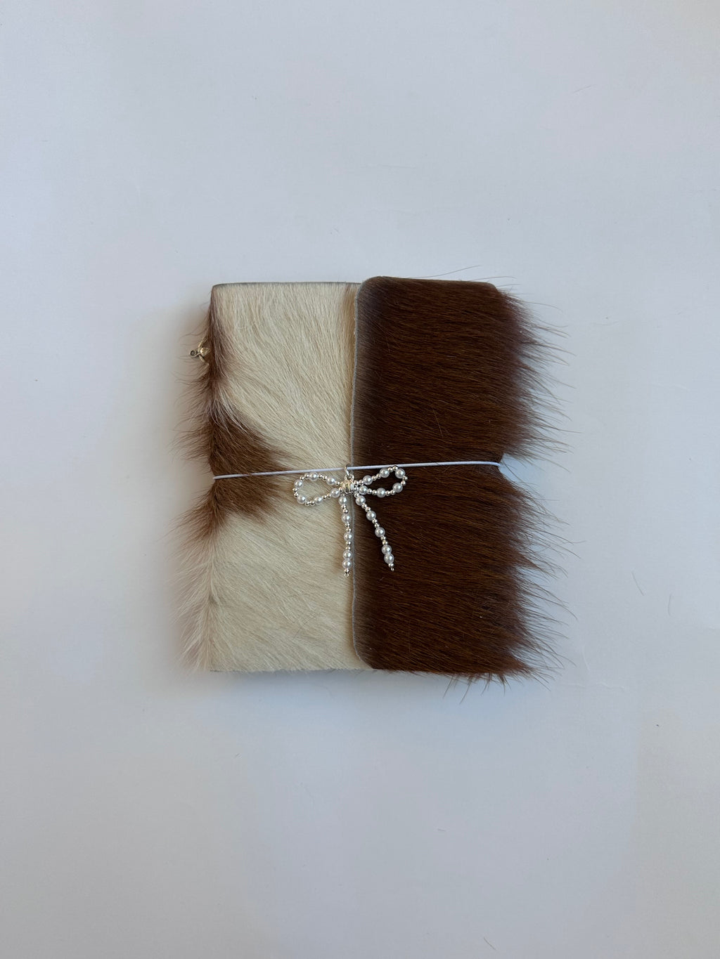 brown cowhide with surprise charm 🐮