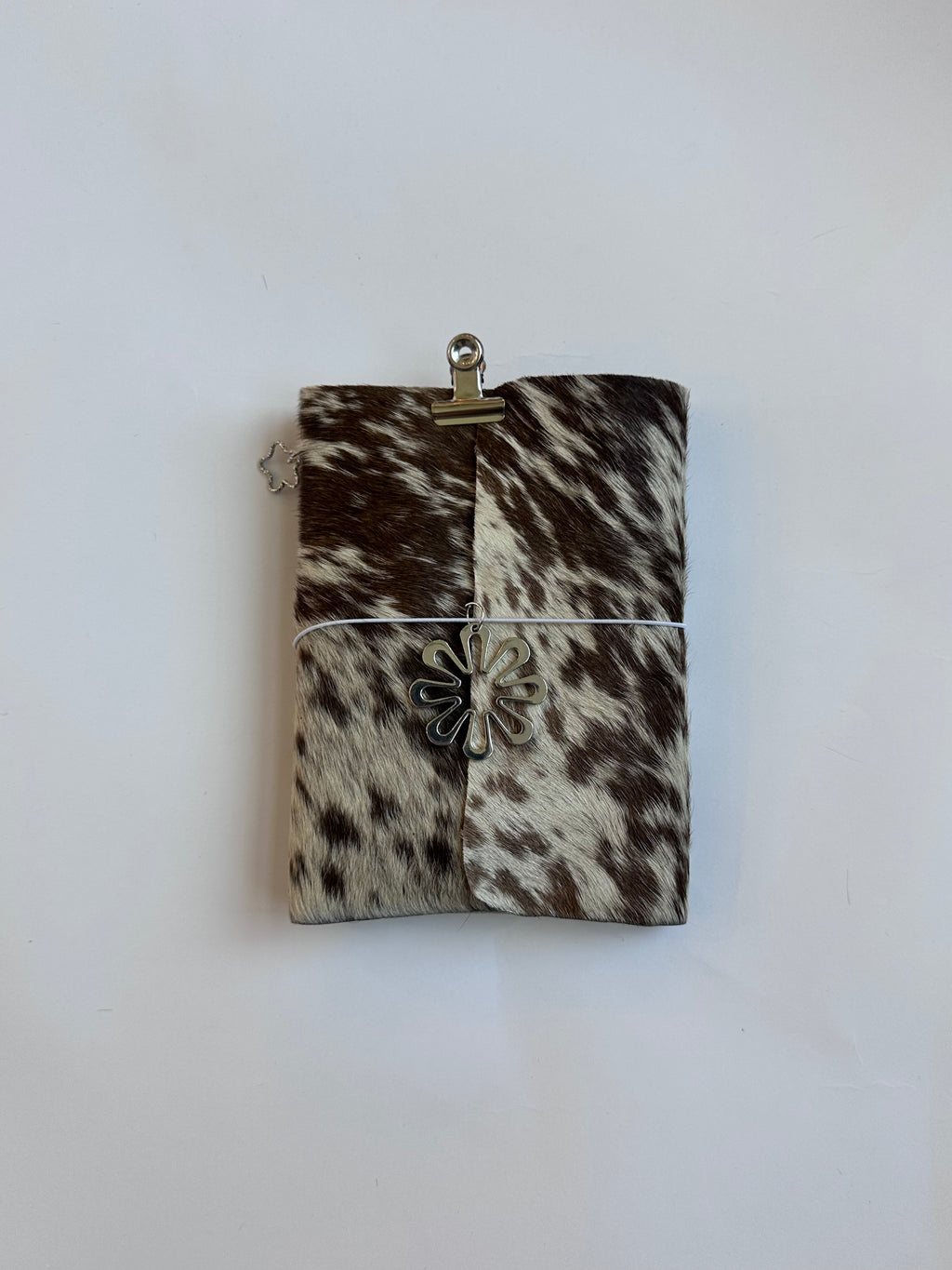 brown cowhide with surprise charm 🐮