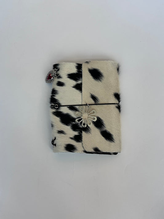 dark cowhide with surprise charm 🐮